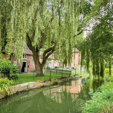 Listen to the river flowing past the garden