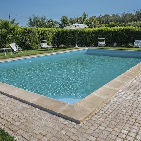 Spend your afternoons around the pool, barbecuing, lounging in the sun, and cooling off in the pool
