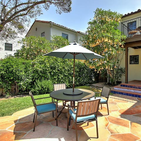 Dine alfresco on sunny days in the private back garden