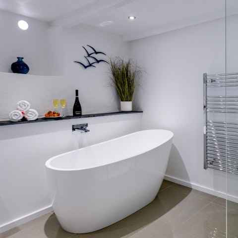 Treat yourself to a long soak in the freestanding bathtub