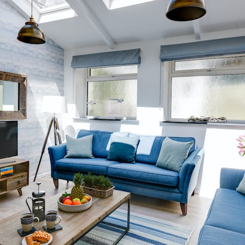 Unwind in the comfy, bright living room