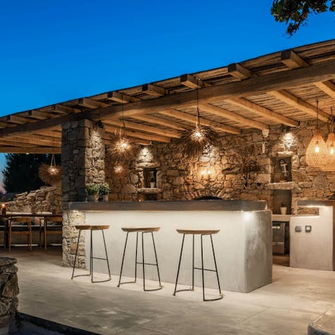 Mix your favourite cocktails at the bar to sip under the stars