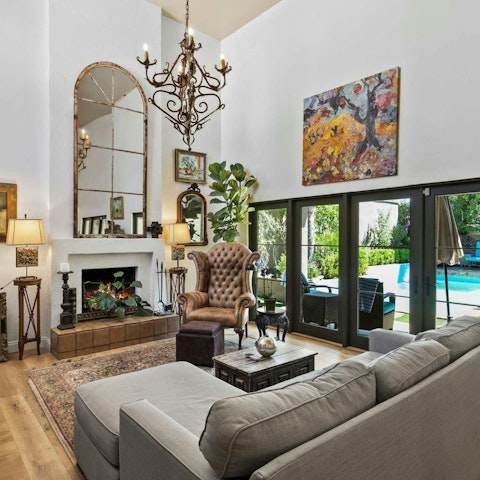 Unwind amid eclectic artwork in the open-plan living and dining space