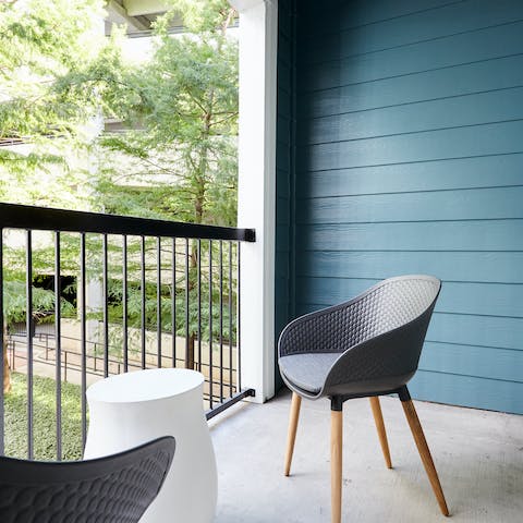 Sip a cold beer on your private balcony