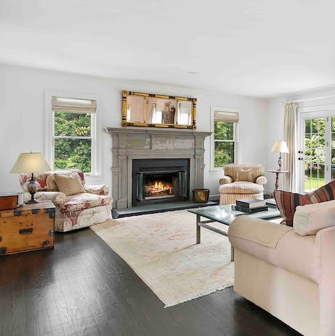 Curl up with a good book next to the cosy fireplace