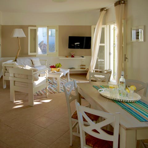 Take a break from the sun in the breezy, white-washed living area