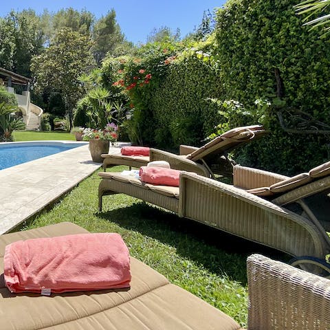 Soak up the sunshine from the plush poolside loungers