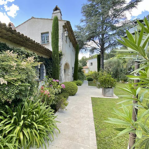 Wander around the home's stunning Mediterranean gardens