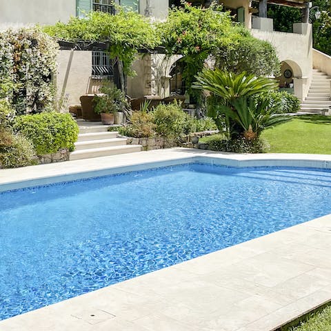 Dip in the glistening swimming pool