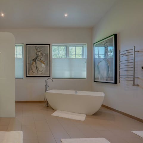Treat yourself to some well-deserved me-time in the elegant freestanding bathtub