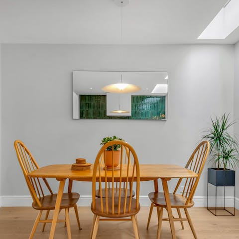 Dine altogether in the light-filled, open-plan living room