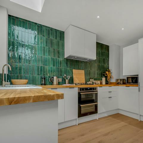 Prepare family favourites in the jewel-like emerald green kitchen