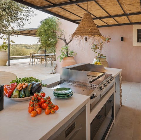 Cook up meals in the outdoor kitchen