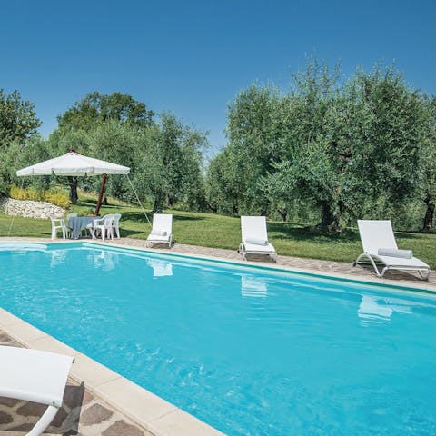 Soak up the Italian sun beside the private pool
