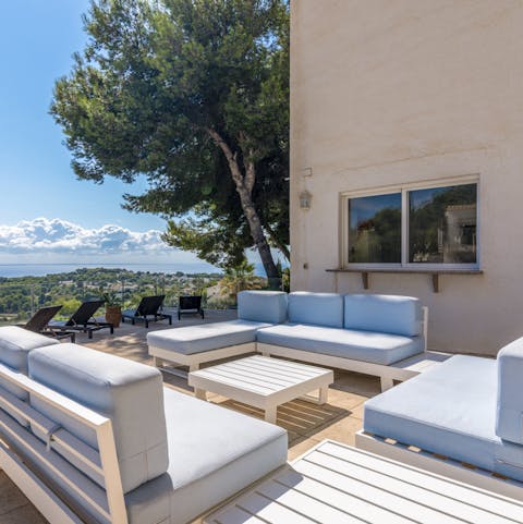 Spend evenings relaxing with a glass of wine on the outdoor sofas