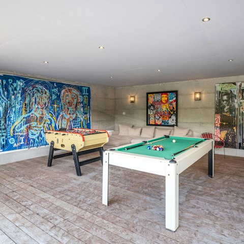 Get competitive with a game of foosball or pool