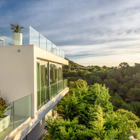 Enjoy panoramic views from your secluded hillside setting