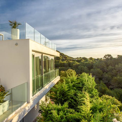 Enjoy panoramic views from your secluded hillside setting