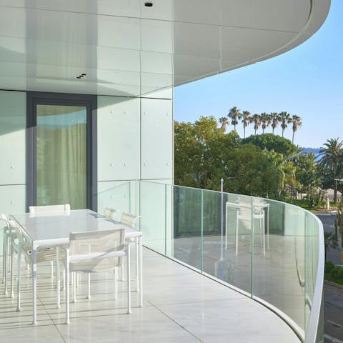 Watch the Côte d’Azur light up at dusk from the private balcony