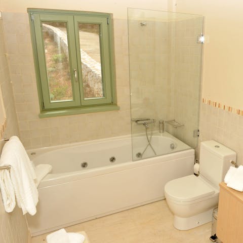 Sink back into the soothing bubbles of the Jacuzzi bathtub