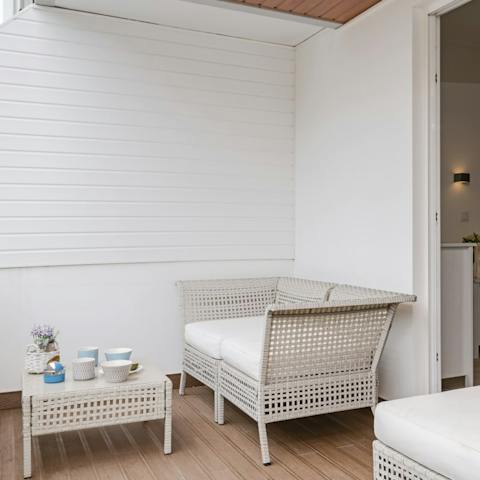 Watch the sunset over the city with a glass of wine