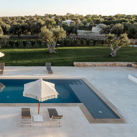 Soak up the views of the olive groves from the poolside
