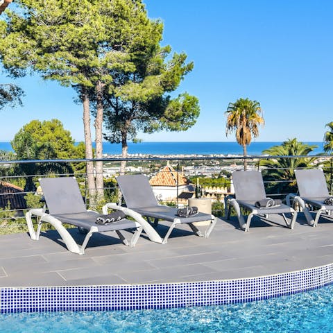 Pour yourself a drink to sip on one of the sun loungers