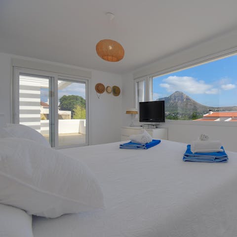 Pad out onto the bedroom's balcony and bid the Montgo Mountain a good day