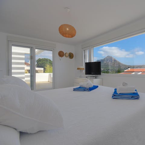 Pad out onto the bedroom's balcony and bid the Montgo Mountain a good day