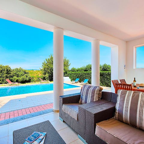 Escape from the midday heat in the comfy lounge area