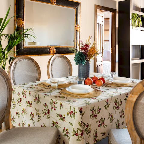 Gather around the cute dining table for relaxed dinners, drinks, and card games at home