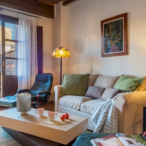 Relax on the plush sofa and recline on the leather chair after a long day of exploring the city