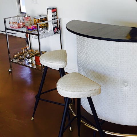 Mix a classic cocktail to enjoy at the retro bar