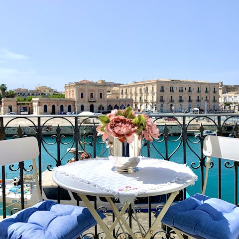 Enjoy coffee or cocktails on the private balcony