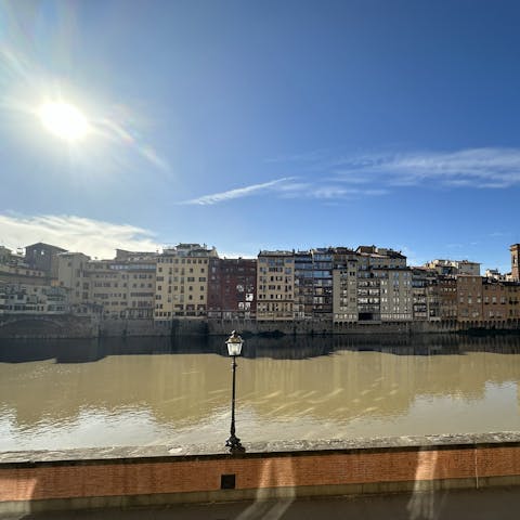 Take in the views of the River Arno from one of two Juliet balconies