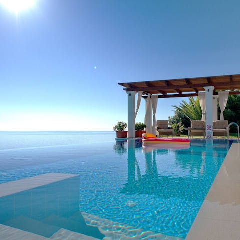 Take a dip in the glistening infinity pool with panoramic ocean views