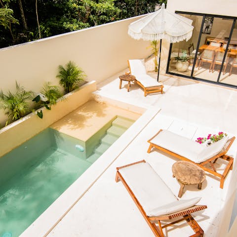 Lounge in the sun before cooling off in the private pool