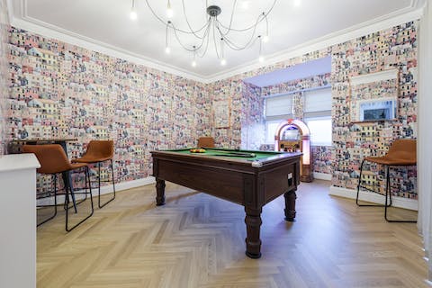 Listen to music from the jukebox as you play a game of pool