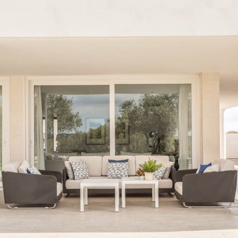 Have sundowners on the sofas of the shady porch