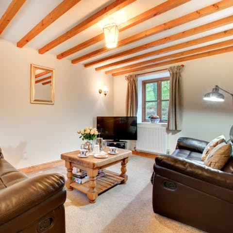 Admire original, rustic features like the exposed beams on the ceiling