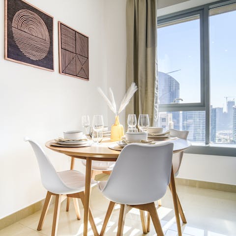 Dine by the window in the light-filled living space and admire impressive Dubai vistas