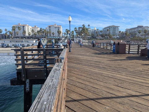 Explore Oceanside Harbor's yacht-filled marina, seafood restaurants, and surf shops
