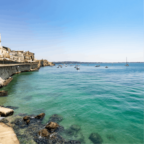 Take the short drive to the stunning clear waters of the Sicilian coast