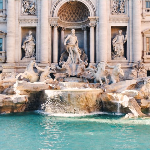 Admire the Trevi Fountain, a seven-minute walk from your door