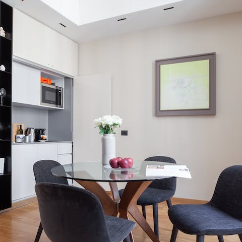 Start mornings off with an espresso at the elegant glass dining table