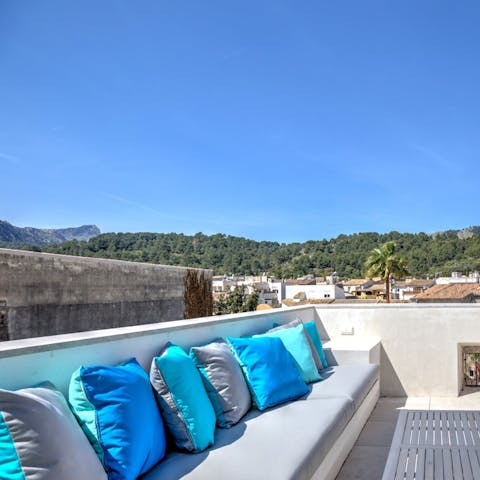 Toast the day’s end from the rooftop terrace overlooking Pollensa Old Town