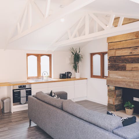 Lounge back on the long grey sofa with a new book in hand