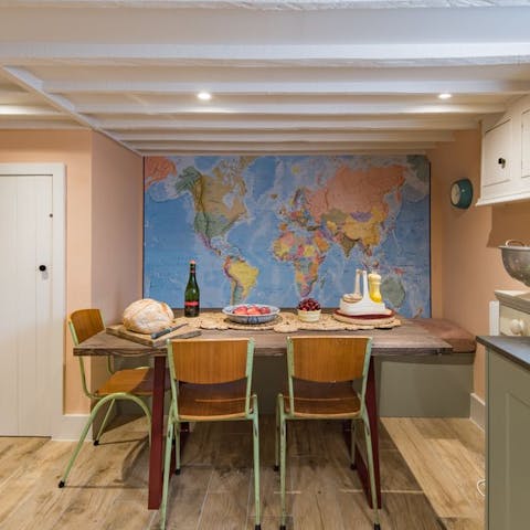 Gather round the mid-century style dining table for relaxed dinners at home