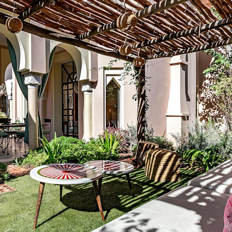 Sip Moroccan mint tea in the dappled sunshine