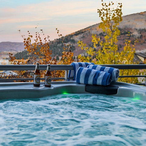 Soak in the private hot tub with alpine vistas